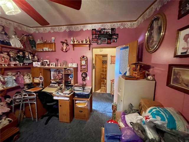 office area with crown molding, ceiling fan, and carpet floors