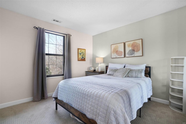 bedroom with visible vents, light colored carpet, and baseboards