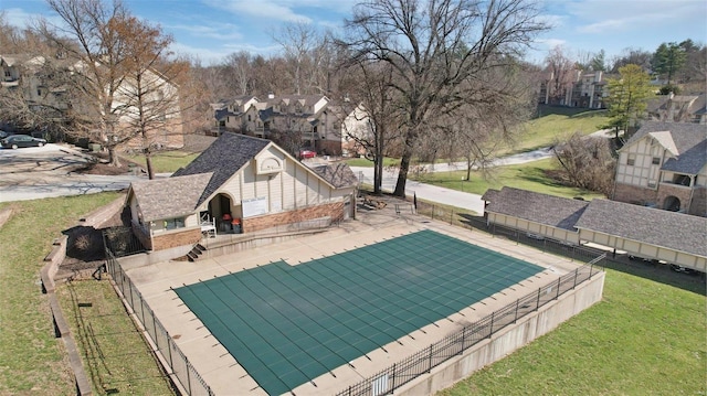 view of pool featuring a residential view, a lawn, a patio, and fence