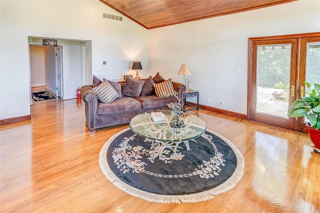 living area featuring visible vents, baseboards, wood ceiling, wood finished floors, and high vaulted ceiling