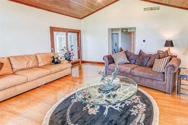 living room with visible vents, ornamental molding, wood finished floors, wooden ceiling, and baseboards