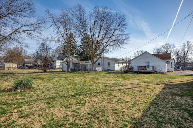 view of yard with a wooden deck and fence