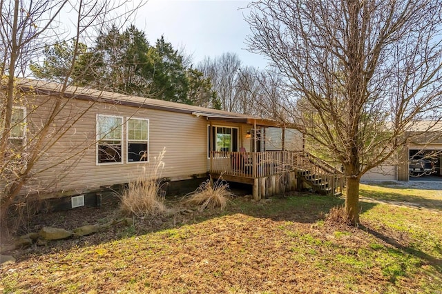 manufactured / mobile home with a wooden deck