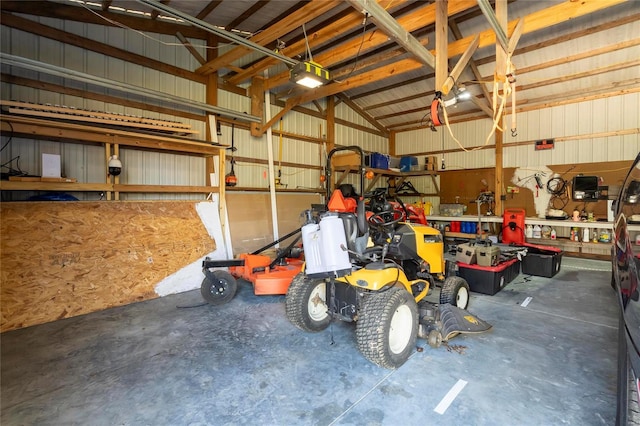 garage with a workshop area and metal wall