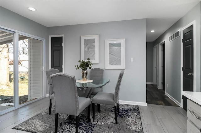 dining room with light tile patterned floors, visible vents, recessed lighting, and baseboards