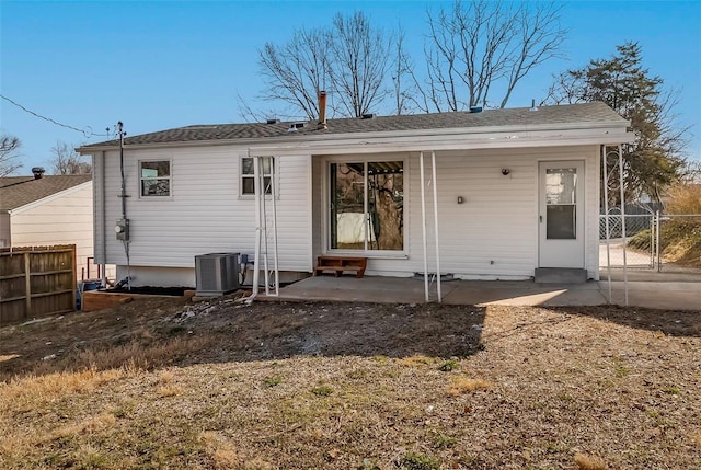 back of house with a patio area, a gate, and fence