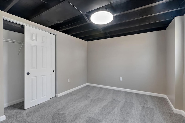 finished basement with baseboards and carpet floors