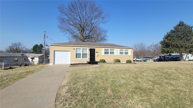 ranch-style home featuring a front lawn, an attached garage, fence, and driveway