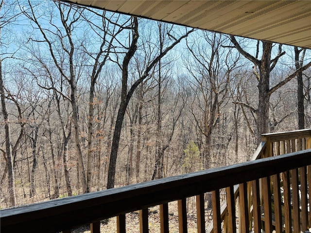 balcony featuring a view of trees