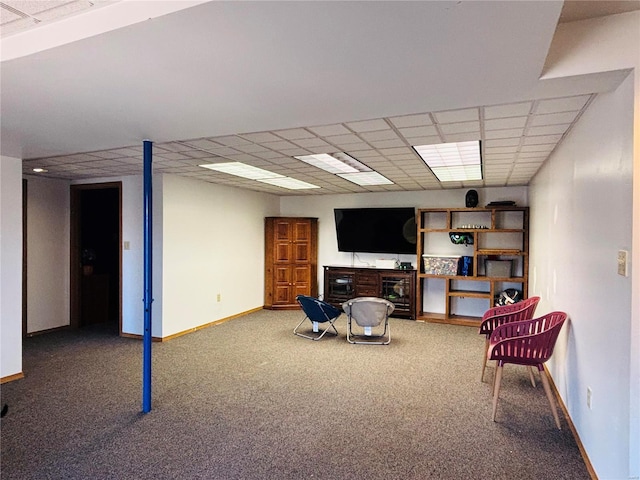 sitting room featuring baseboards, a paneled ceiling, and carpet flooring