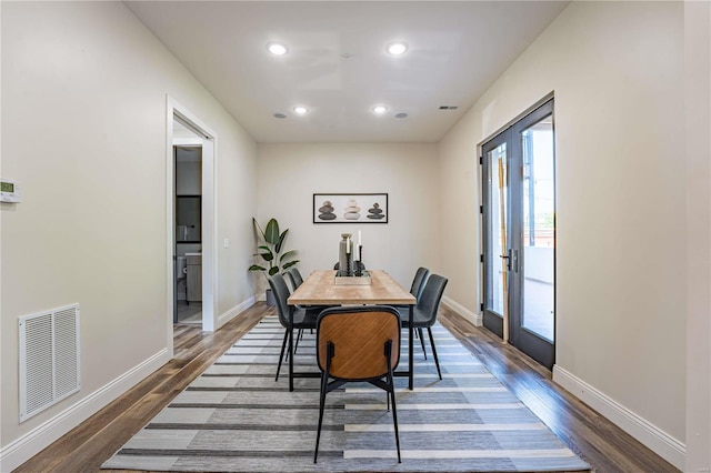 dining area with dark wood-type flooring, recessed lighting, visible vents, and baseboards