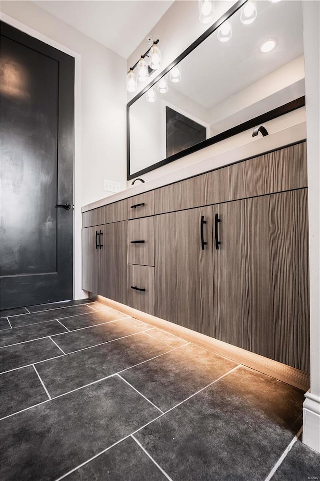 bathroom with tile patterned floors and vanity