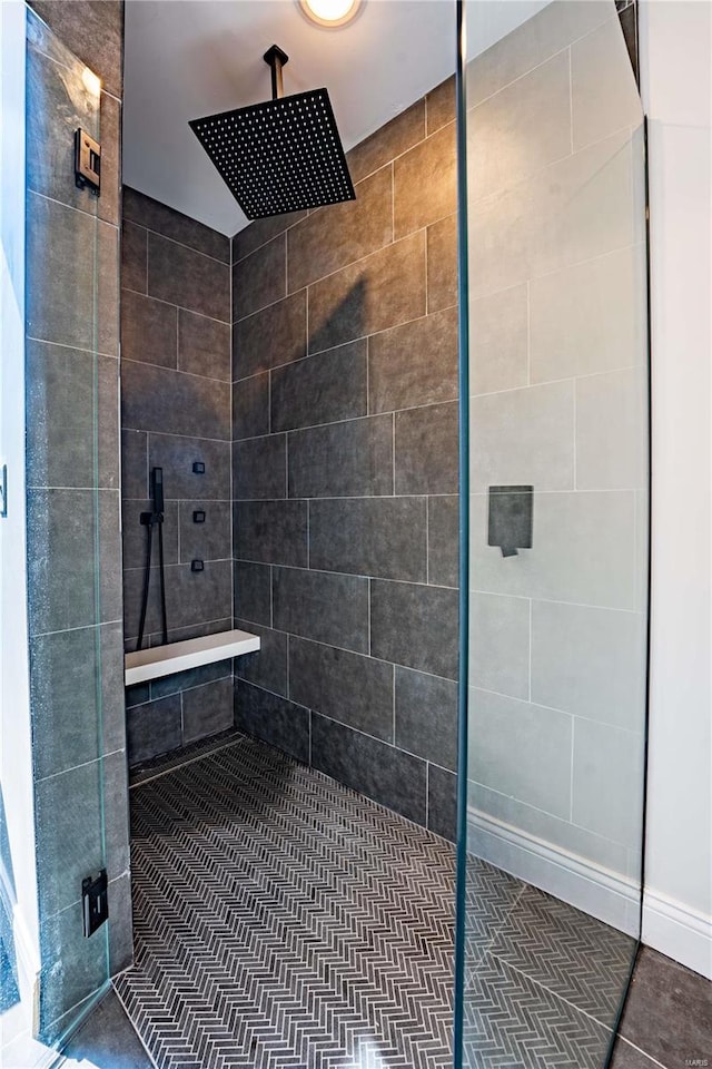 bathroom with a tile shower