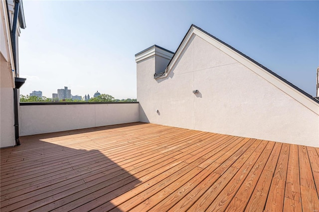 wooden deck featuring a view of city