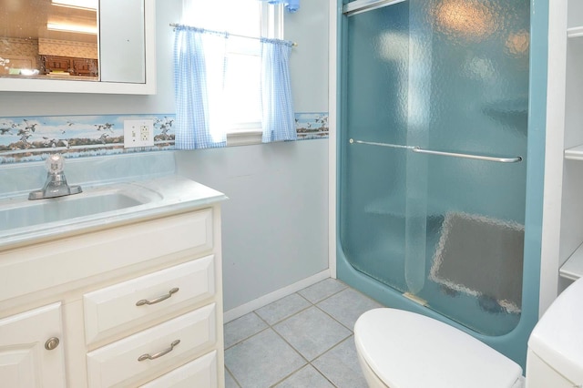 bathroom with tile patterned floors, toilet, a shower stall, baseboards, and vanity