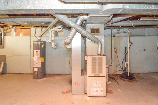 unfinished below grade area with water heater, heating unit, and visible vents