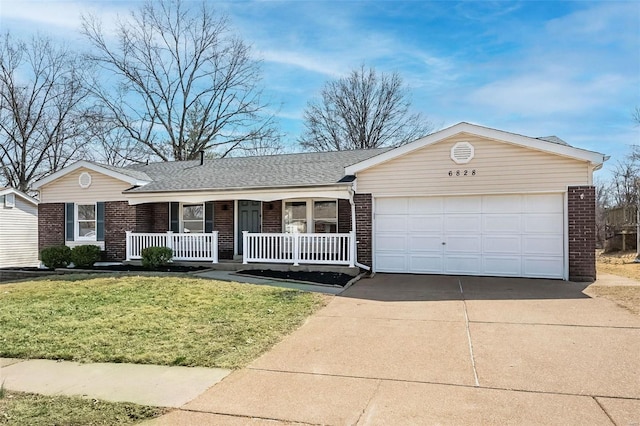 single story home with a front lawn, driveway, covered porch, a garage, and brick siding