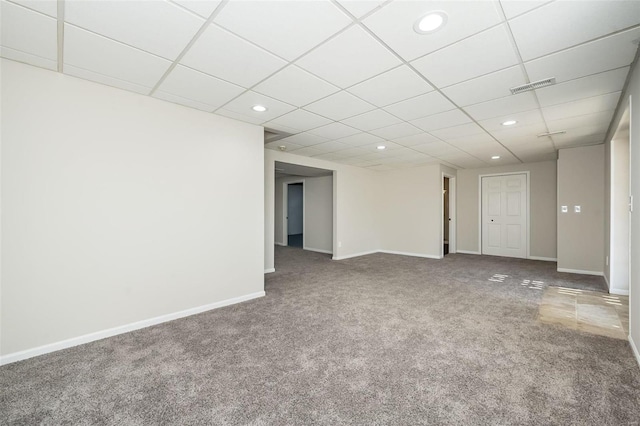 interior space with a paneled ceiling, visible vents, baseboards, and recessed lighting