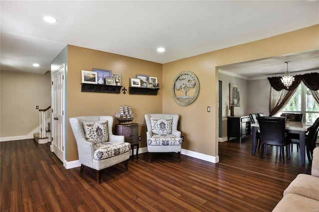 living area featuring wood finished floors, recessed lighting, stairway, an inviting chandelier, and baseboards