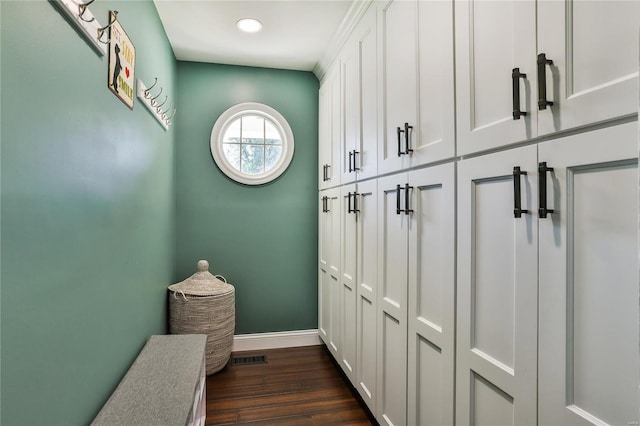 mudroom with recessed lighting, baseboards, and dark wood-type flooring