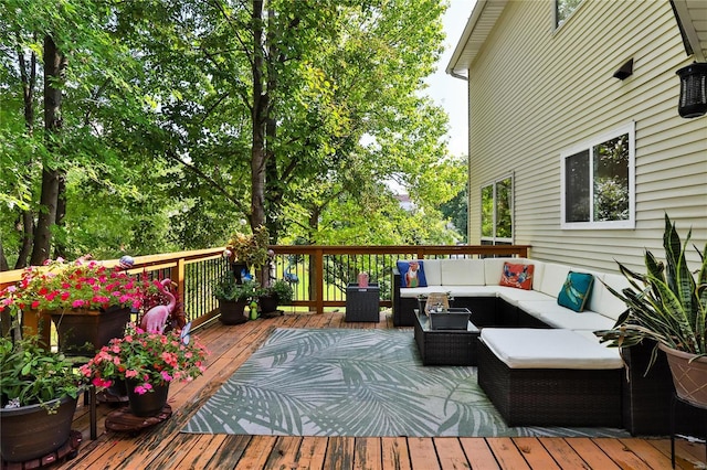 wooden terrace with an outdoor hangout area