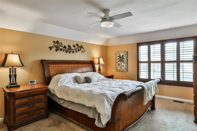 bedroom with visible vents, carpet flooring, baseboards, and ceiling fan