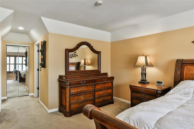 bedroom with baseboards, lofted ceiling, and carpet flooring