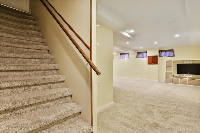 staircase featuring recessed lighting, baseboards, and carpet floors