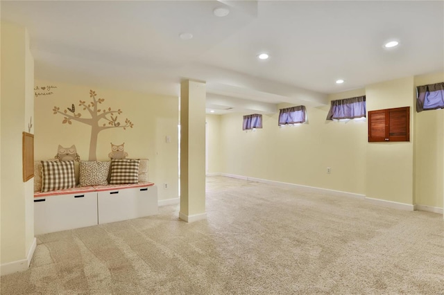 below grade area with recessed lighting, baseboards, and light colored carpet