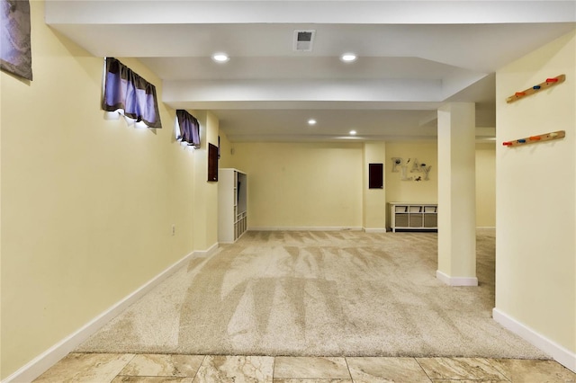 finished below grade area with recessed lighting, visible vents, baseboards, and carpet