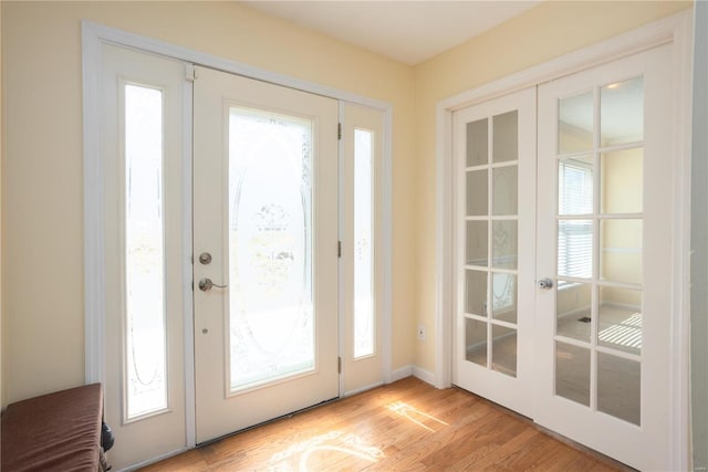 entryway featuring french doors and light wood finished floors