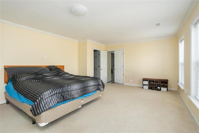 carpeted bedroom featuring baseboards and ornamental molding