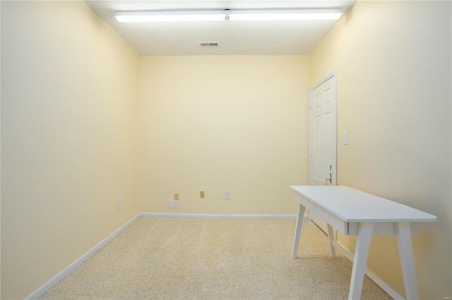 empty room featuring visible vents, carpet flooring, and baseboards