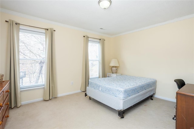 bedroom with baseboards, light carpet, and crown molding