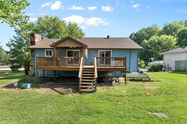 rear view of property with a lawn, stairway, a shingled roof, a wooden deck, and a chimney