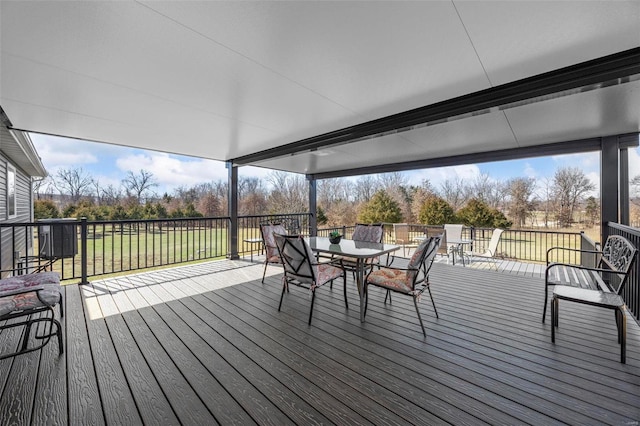 wooden deck with outdoor dining space