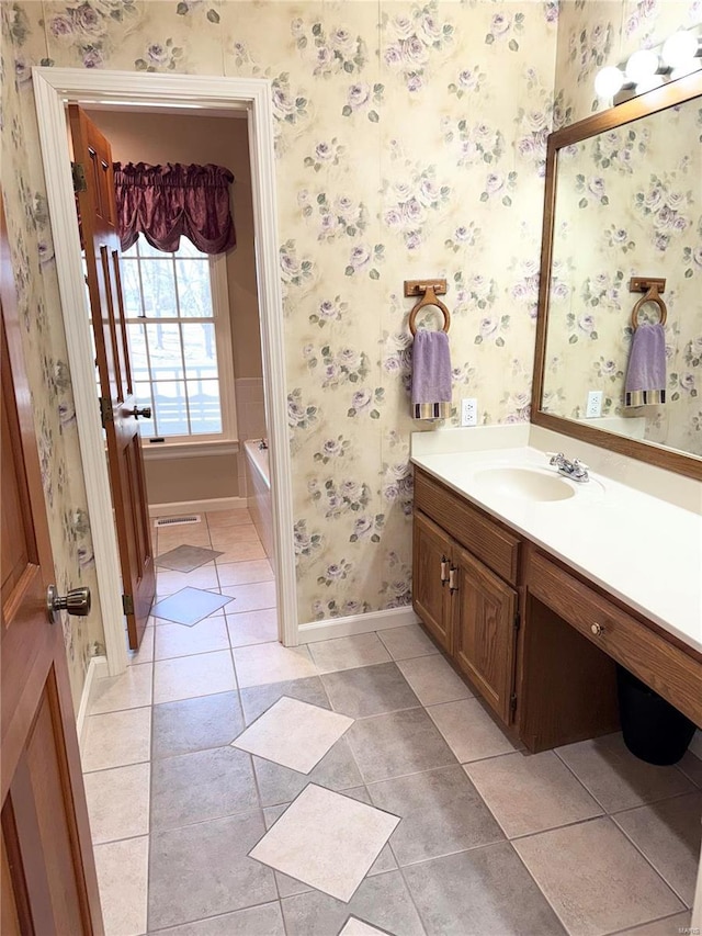 full bathroom featuring tile patterned flooring, wallpapered walls, and vanity