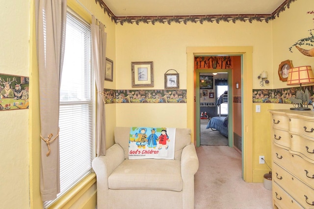 sitting room with light colored carpet