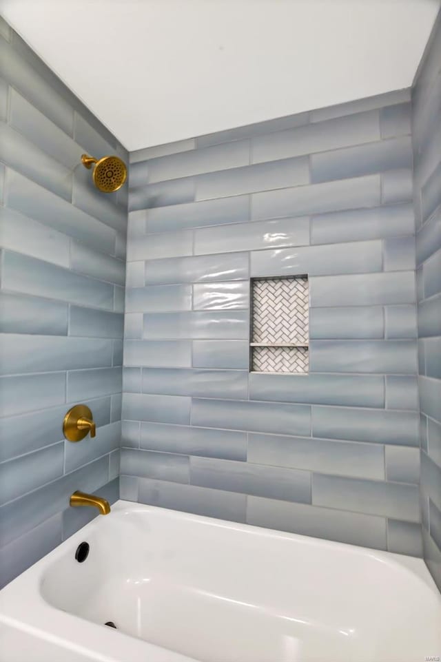 bathroom with shower / tub combination