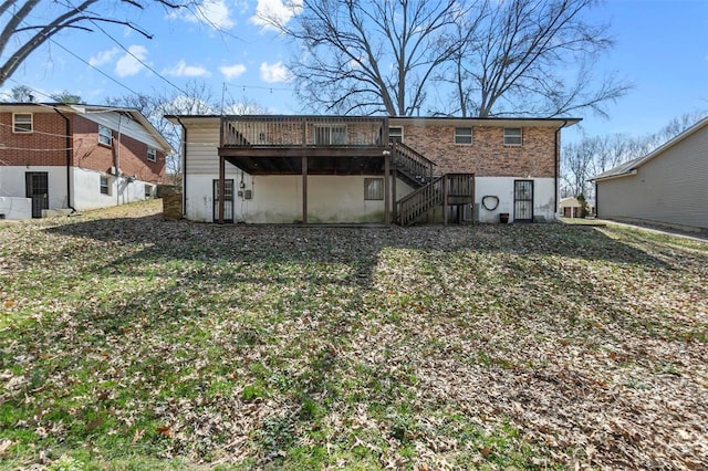 back of property with stairs and a wooden deck