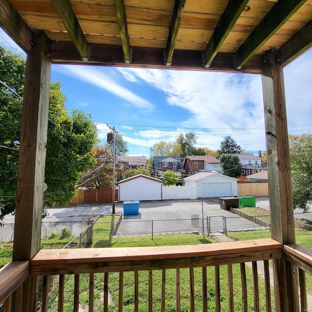 wooden deck featuring a yard and a fenced backyard