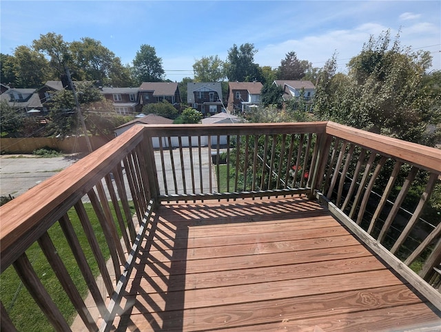 wooden terrace with a residential view