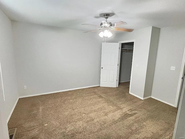 unfurnished bedroom featuring carpet, baseboards, a closet, and ceiling fan