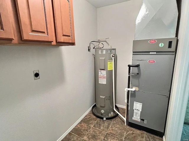 utility room featuring heating unit and water heater