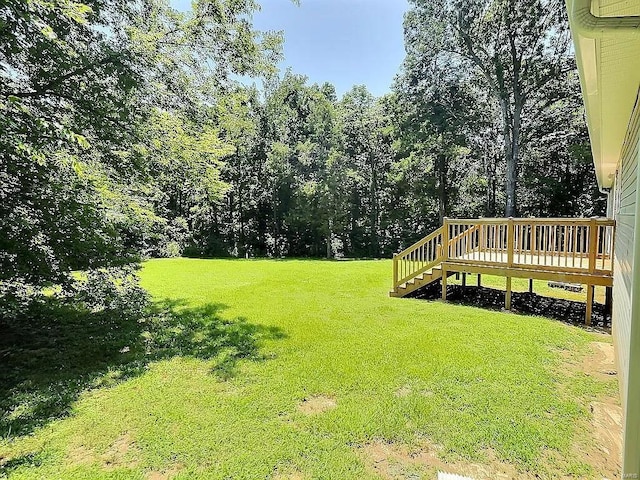 view of yard featuring a wooden deck