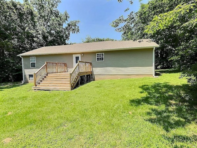 back of house featuring a wooden deck, stairs, and a yard