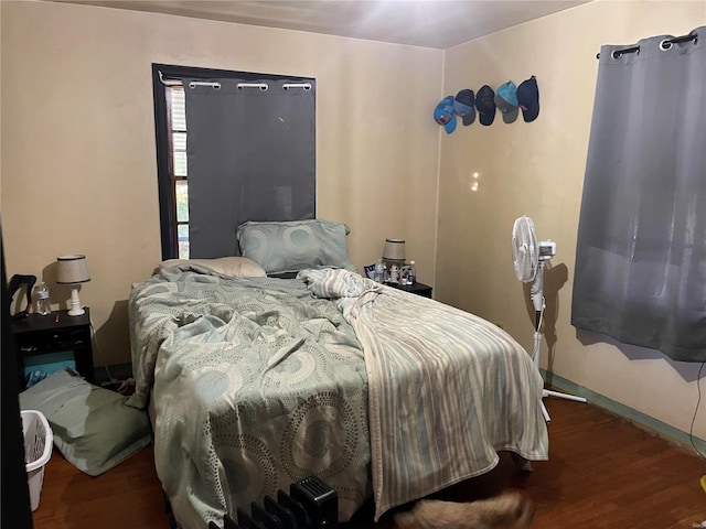 bedroom featuring wood finished floors