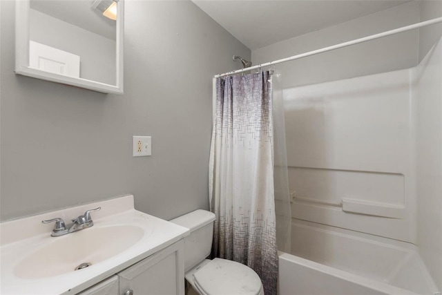 bathroom featuring toilet, shower / bath combo, and vanity