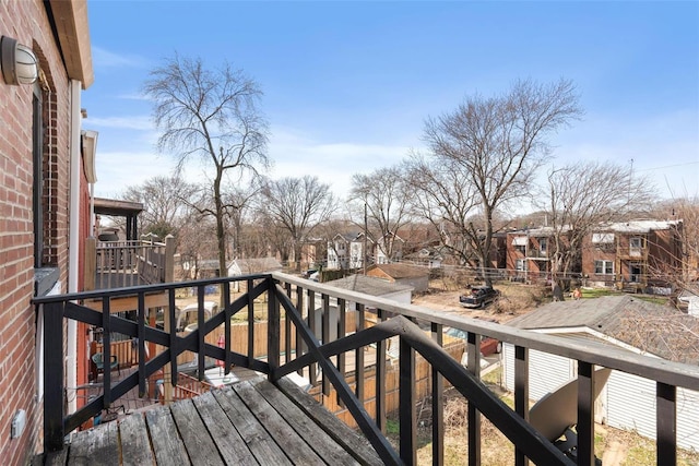 wooden deck featuring a residential view