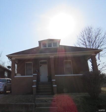 bungalow-style home with covered porch